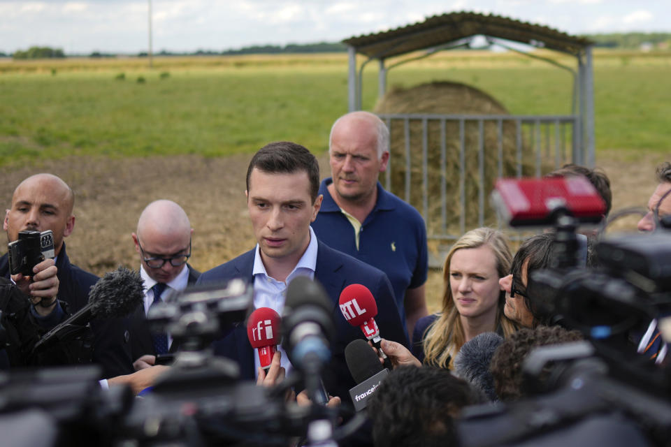 FILE - Jordan Bardella far-right National Rally leader for the upcoming election speaks to the media as he visits a farm in Chuelles, 137 kms (85 mls) south of Paris, Friday, June 14, 2024. At just 28 years old, Jordan Bardella has led the French far right to a landslide victory in the European Parliament election in June. After voters propelled Marine Le Pen's National Rally to a strong lead in the first round of national legislative elections on Sunday, Bardella has turned to rallying supporters to grant Marine Le Pen's party an absolute majority in the decisive round of voting on July 7 and make him the prime minister of France. (AP Photo/Thibault Camus, File)