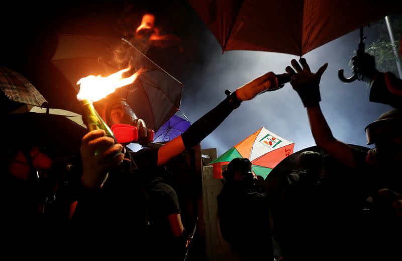 Pictures of the Year: Hong Kong protest tide turns into sea of flames