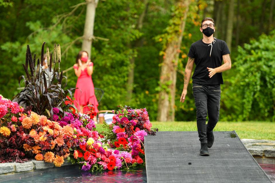 Christian Siriano walks the runway at his recent show in Westport, Connecticut.