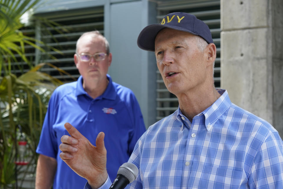 Senator Rick Scott, R-Fla., right, speaks during a news conference after having toured the National Hurricane Center with director Ken Graham, left, Tuesday, June 1, 2021, at the center in Miami. Tuesday marks the start of the 2021 Atlantic hurricane season which runs to Nov. 30. (AP Photo/Wilfredo Lee)