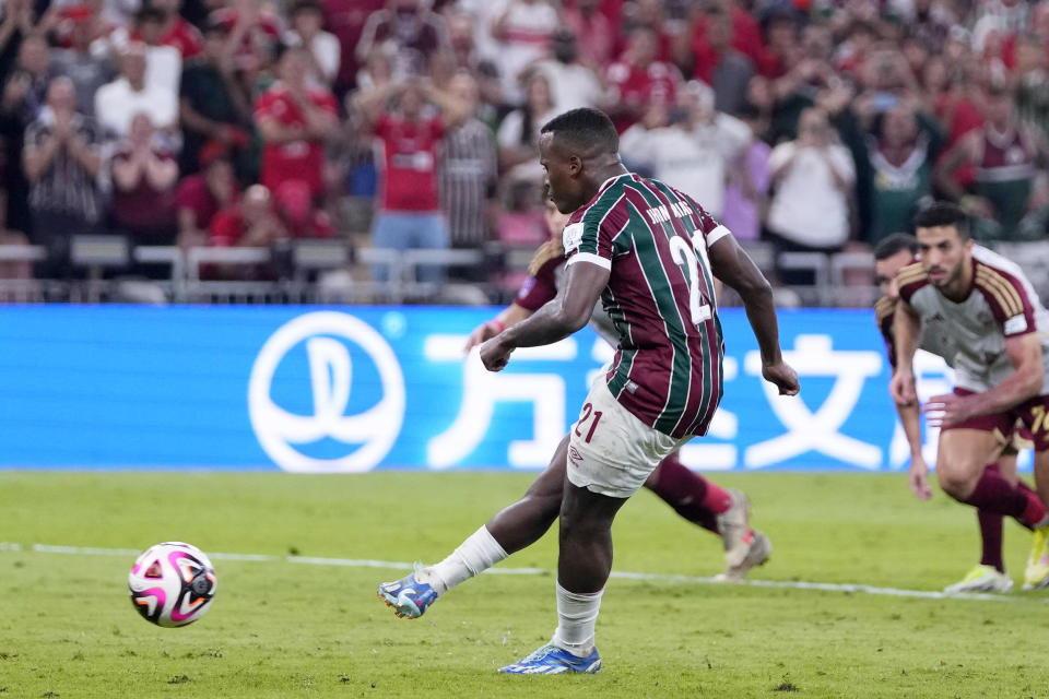 Fluminense's Jhon Arias scores the opening goal from the penalty spot during the Soccer Club World Cup semifinal soccer match between Fluminense FC and Al Ahly FC at King Abdullah Sports City Stadium in Jeddah, Saudi Arabia, Monday, Dec. 18, 2023. (AP Photo/Manu Fernandez)