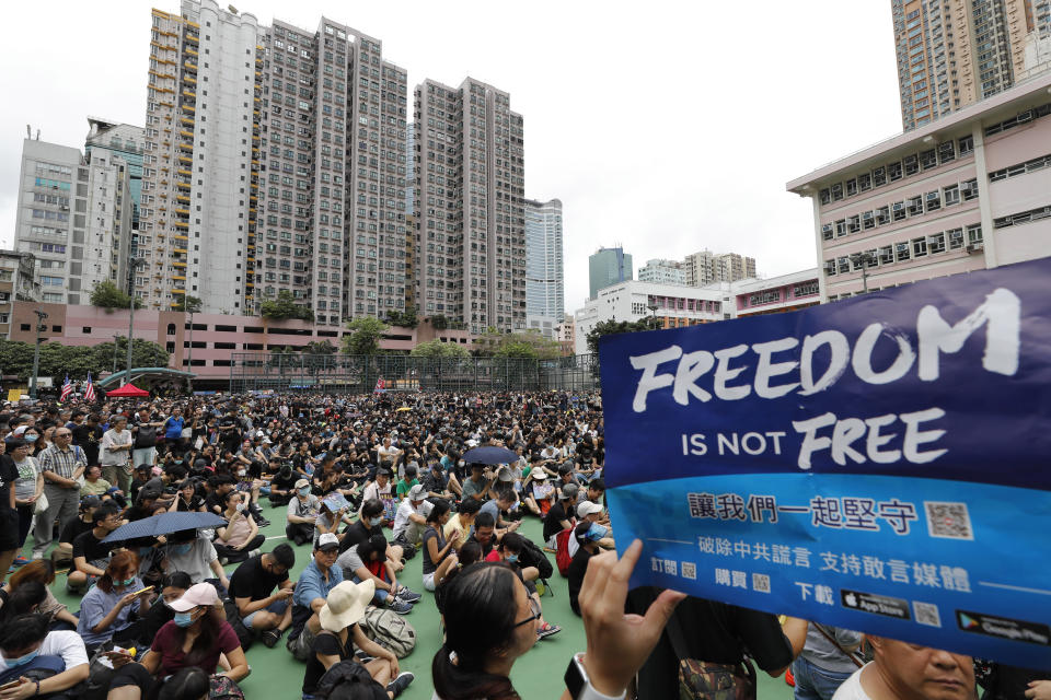 People gather at a public park ahead of a planned demonstration in Hong Kong, Saturday, Aug. 3, 2019. Hong Kong police on Saturday called on protesters to stick to designated routes and times after violent clashes marred the last eight weekends of rallies calling for greater rights and government accountability. (AP Photo/Vincent Thian)