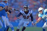 Oct 22, 2017; Carson, CA, USA; Denver Broncos outside linebacker Von Miller (58) rushes Los Angeles Chargers quarterback Philip Rivers (left) after getting by center Spencer Pulley (73) during the fourth quarter at StubHub Center. Mandatory Credit: Jake Roth-USA TODAY Sports