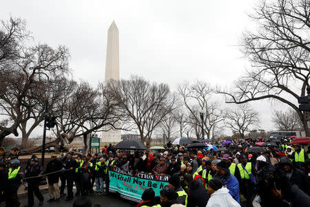 Activists march during the National Action Network's "We Shall Not Be Moved" march in Washington, DC, U.S., January 14, 2017. REUTERS/Aaron P. Bernstein