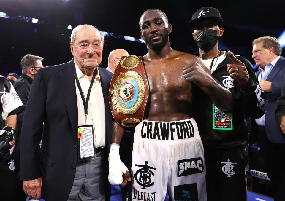 LAS VEGAS, NEVADA - NOVEMBER 20: Bob Arum (L) and Terence Crawford (R) victory pose as he defeats Shawn Porter for the WBO welterweight championship at Michelob ULTRA Arena on November 20, 2021 in Las Vegas, Nevada. (Photo by Mikey Williams/Top Rank Inc via Getty Images)