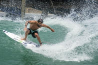 Surfer Italo Ferreira from Brazil works out on a Surf Ranch wave during practice rounds for the upcoming Olympics Tuesday, June 15, 2021, in Lemoore, Calif. This year, Ferreira and fellow Brazilian Gabriel Medina are expected to rule the men's competition at surfing's long-awaited debut as an Olympic sport in the Tokyo 2020 Games. While the surfing community has long pledged that the ocean is for everyone, a look at the professional ranks show a sport that remains expensive and inaccessible. A series of recent industry efforts to help groom the next generation outside of the usual hot spots of Hawaii, California and Australia look to be a tacit acknowledgement of the existing disparities among its talent bench. (AP Photo/Noah Berger)