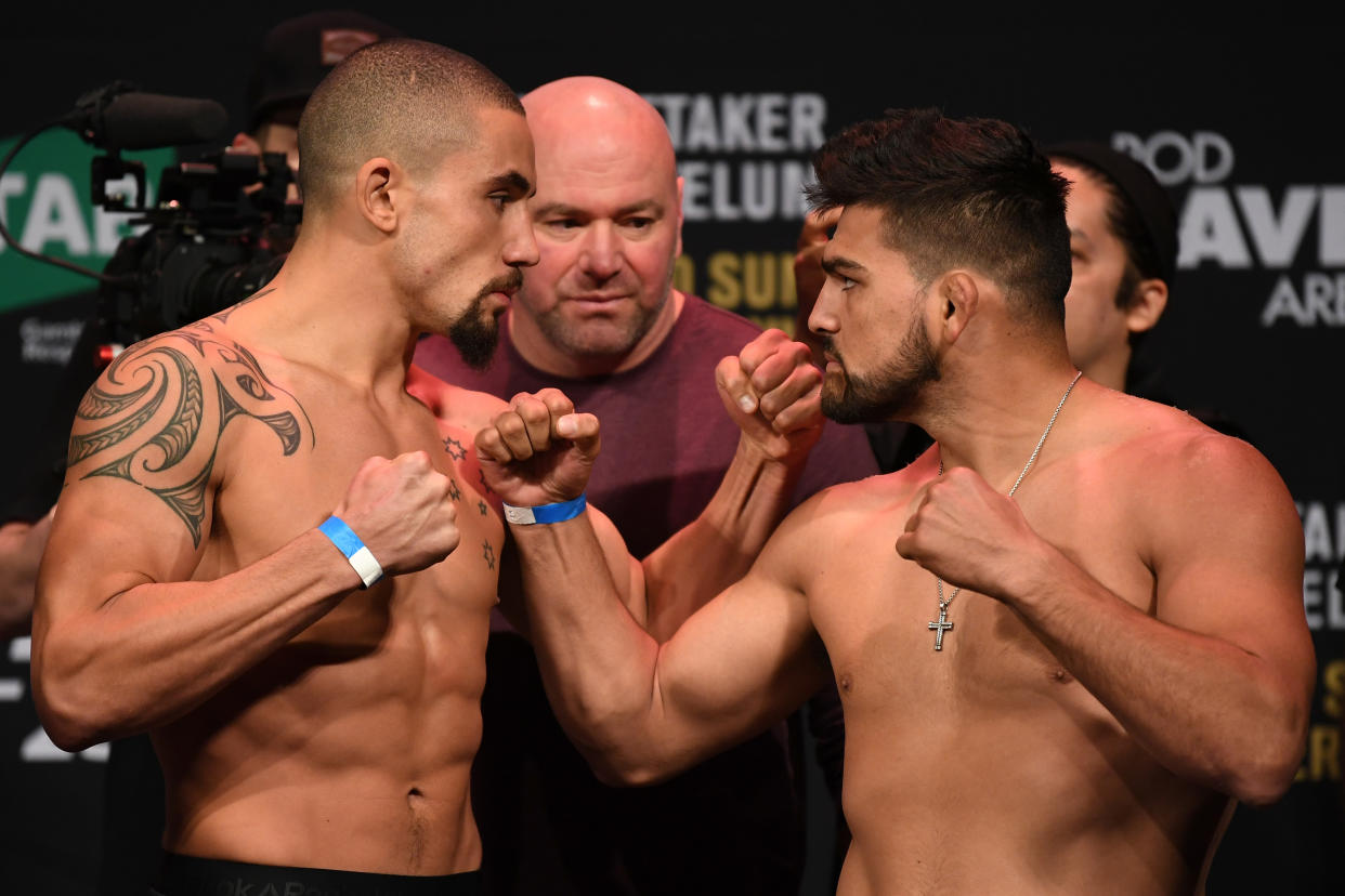 MELBOURNE, AUSTRALIA - FEBRUARY 09:  (L-R) Robert Whittaker of Australia and Kelvin Gastelum face off during the UFC 234 weigh-in at Rod Laver Arena on February 09, 2019 in the Melbourne Australia. (Photo by Jeff Bottari/Zuffa LLC/Zuffa LLC via Getty Images)