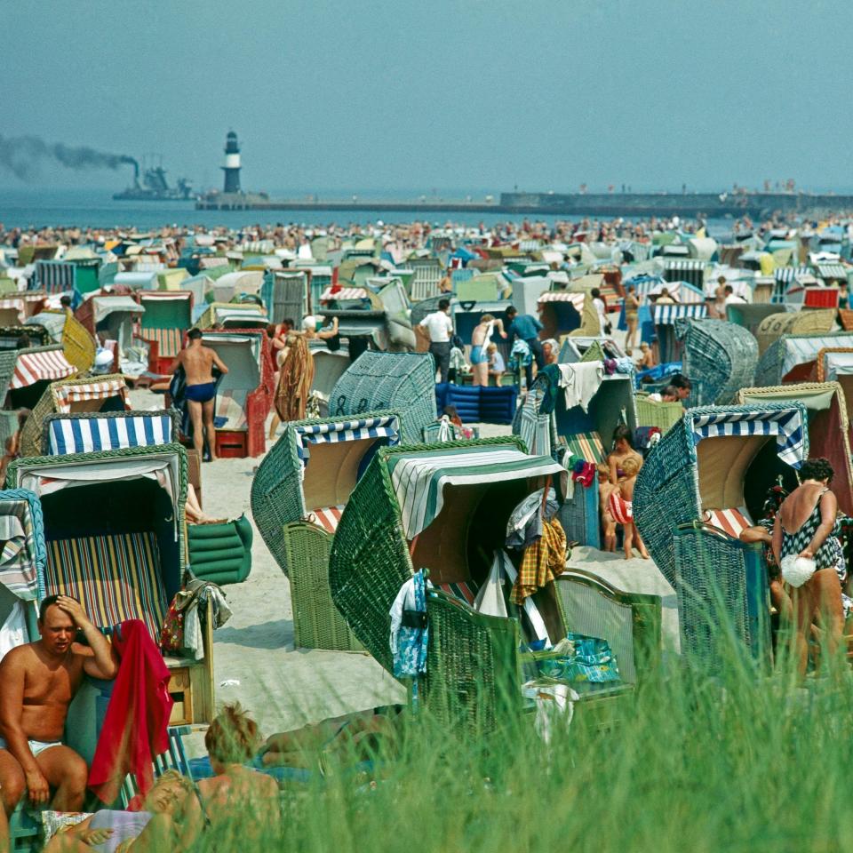 Members of East Germany's Free German Trade Union Federation relaxing on the beach at Warnemünde - Getty Images