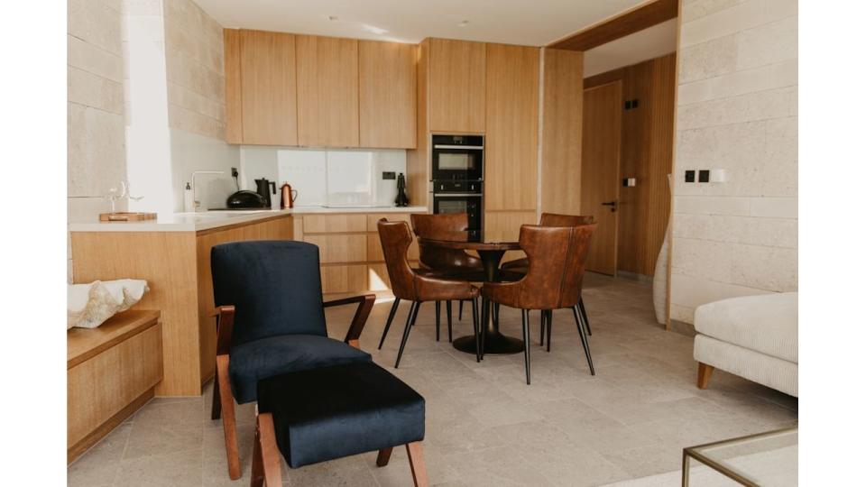 Blue lodge kitchen and dining room at Clifftops on Pennsylvania Castle Estate