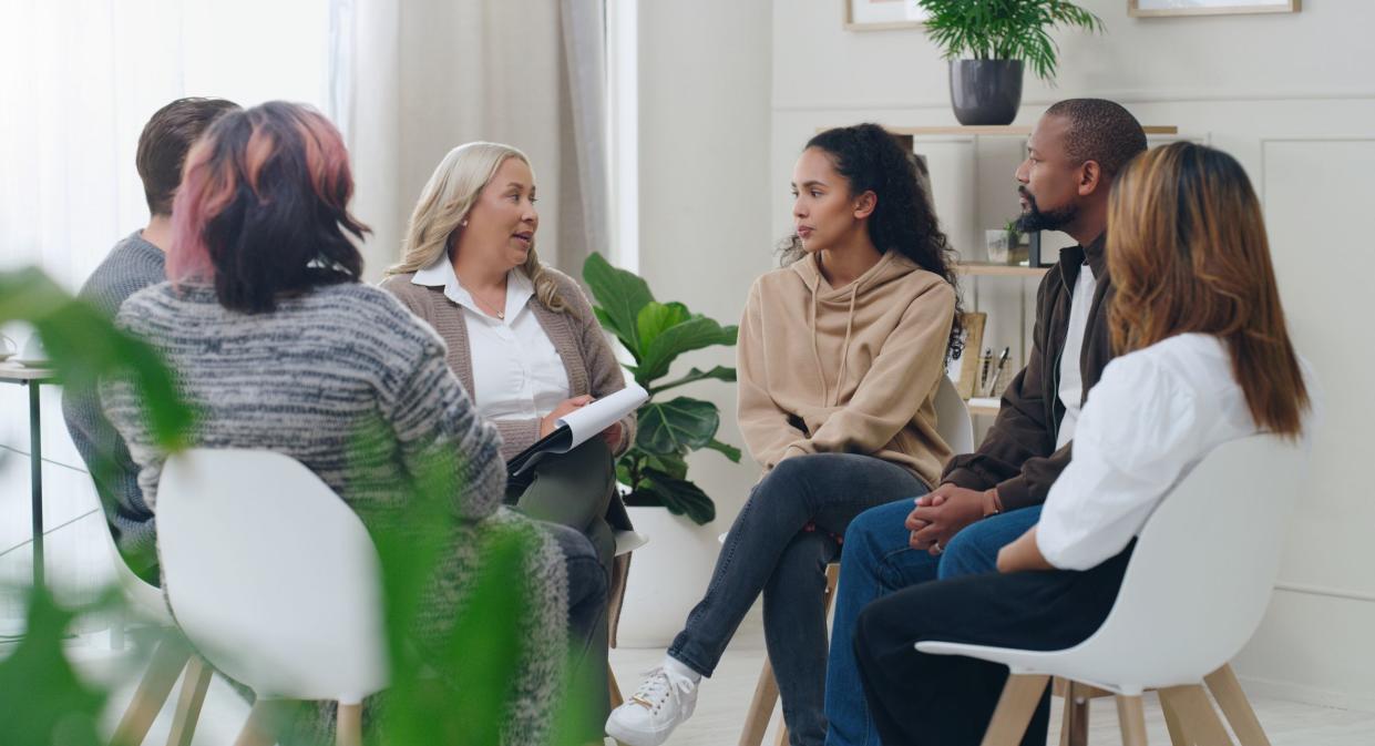 Diversity, mental health and group therapy counseling support meeting, healthy conversation and wellness. Psychology counselor, psychologist help people and talk about anxiety, depression or stress