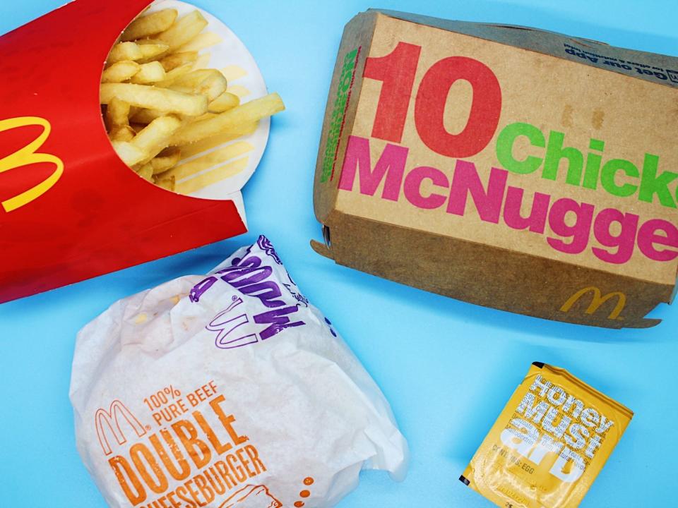 A McDonald's meal of a double cheeseburger, fries, chicken nuggets, and honey mustard sauce