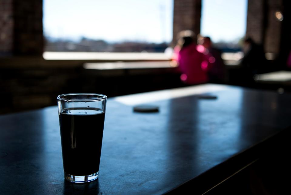 Green Man Brewery's Green Mansion is a three-story expansion that includes a packaging hall, a retail shop, and a tasting room overlooking the mountains.