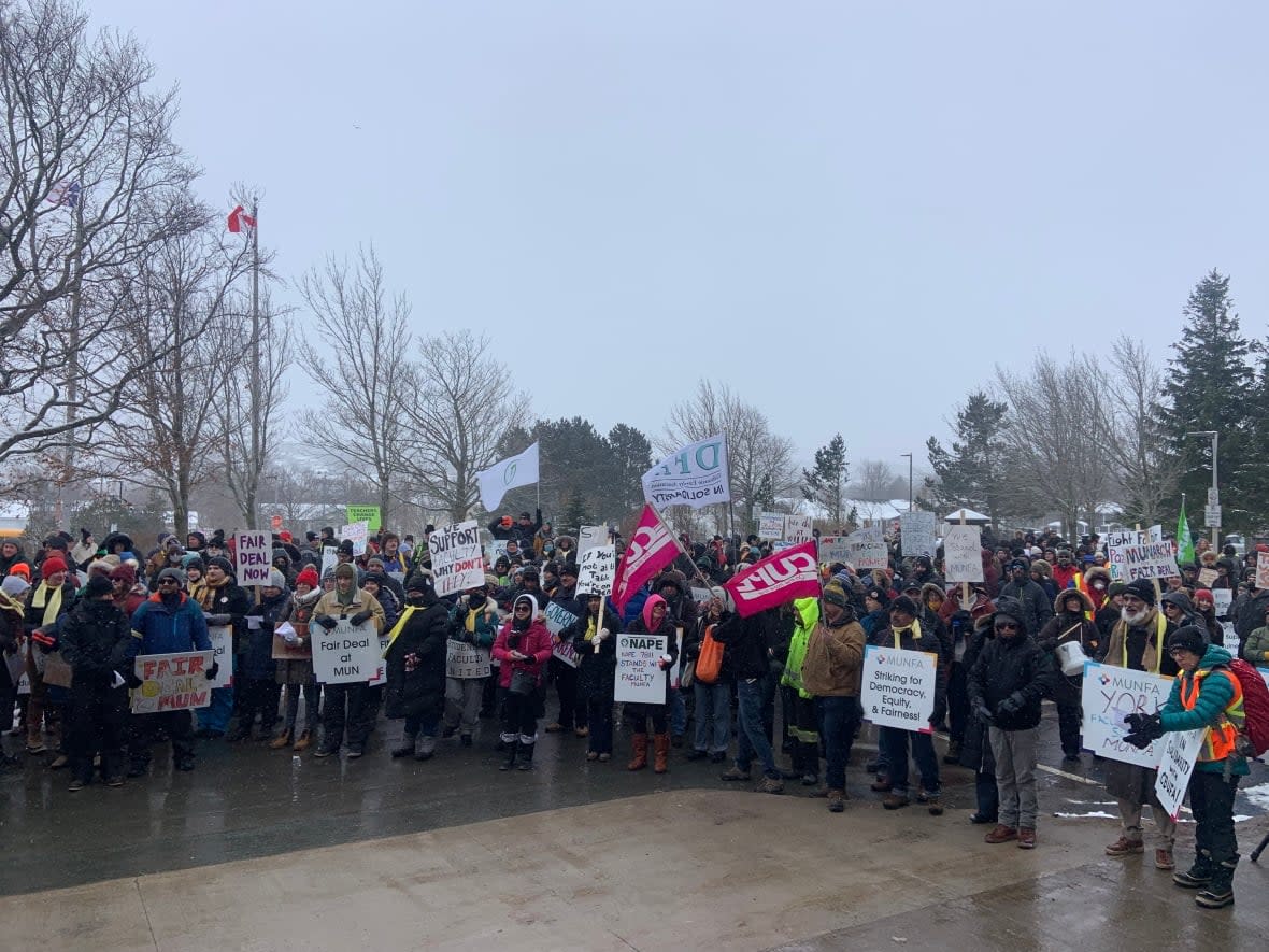 Hundreds gathered for a rally in support of striking members of the Memorial Union of Newfoundland Faculty Association on Friday. (Darrell Roberts/CBC - image credit)