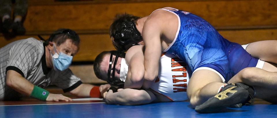 Ashland's Anton Puhach (top) wrestles Wayland's Anthony Brown during a 170 lbs. bout at Ashland Middle School, Jan. 13, 2021.