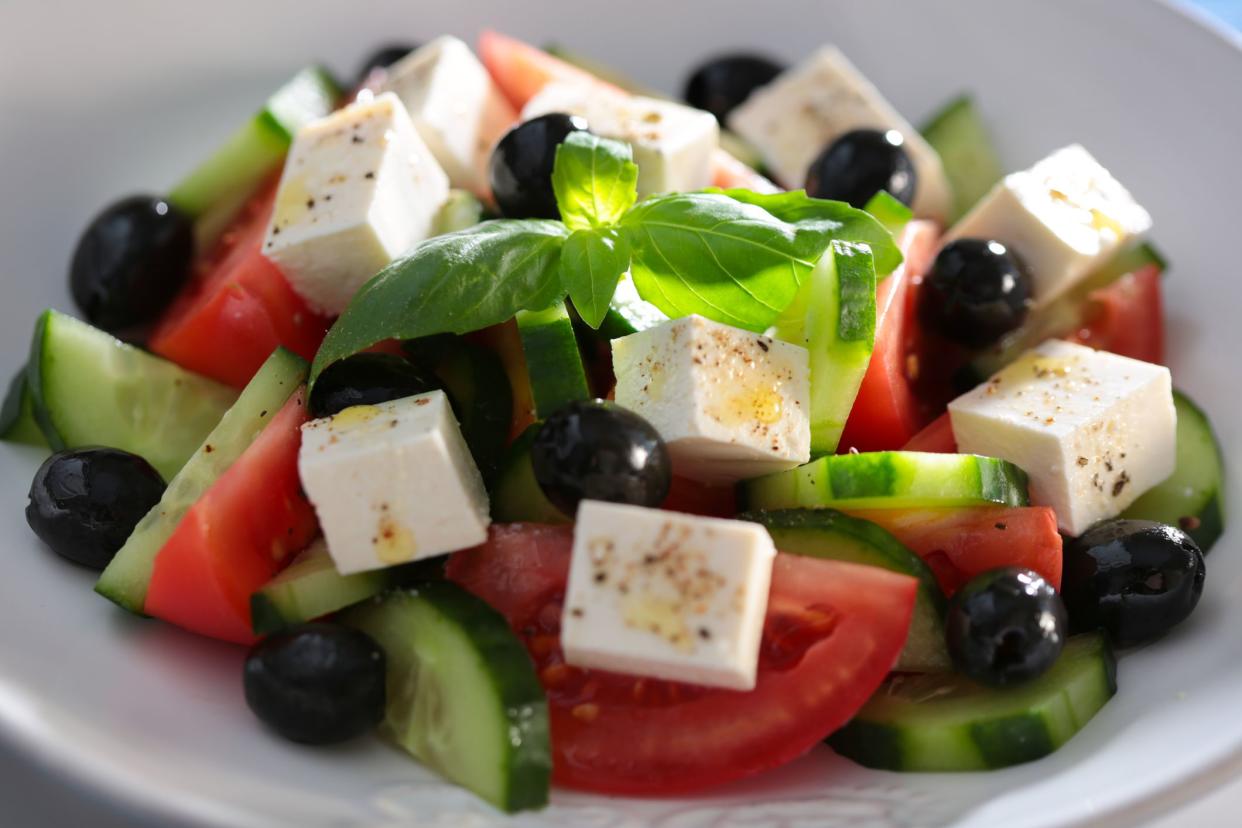 Closeup of Best Greek Salad in a white porcelain bowl