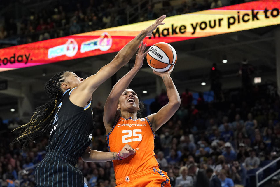 Connecticut Sun forward Alyssa Thomas (25) shoots as Chicago Sky's Candace Parker defends during the first half of Game 2 in a WNBA basketball playoffs semifinal Wednesday, Aug. 31, 2022, in Chicago. (AP Photo/Nam Y. Huh)