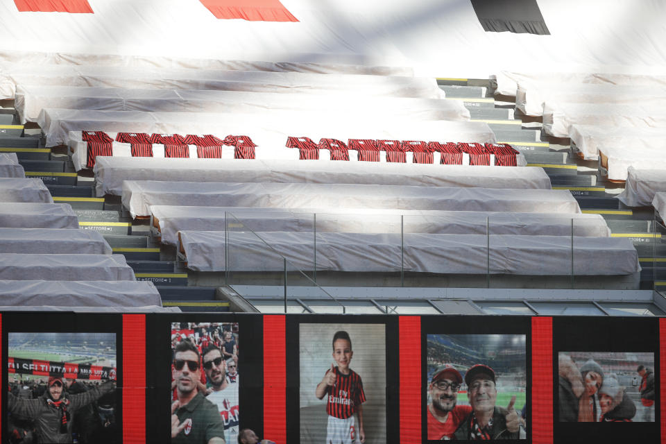 Jerseys to honor the victims of COVID-19 are placed in the stands during the Serie A soccer match between AC Milan and Roma, at the San Siro Stadium in Milan, Sunday, June 28, 2020. It was Milan's first home match since the lockdown and the team put up a huge banner along one side of the empty San Siro stadium that read "Together Forever," dedicated to coronavirus victims. The Lombardy region of which Milan is the capital was the hardest hit area in Italy with more than 16,000 deaths. (AP Photo/Luca Bruno)