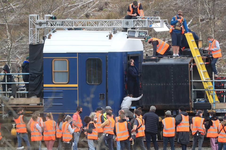 Tom Cruise climbs a modified train carriage (Danny Lawson/PA)