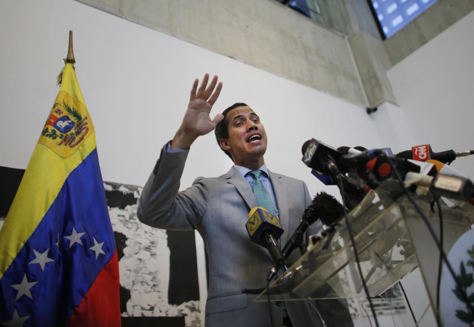 Venezuela's self-proclaimed President Juan Guaido speaks to the press in Caracas, Venezuela, Wednesday, June 26, 2019. Jorge Rodríguez, spokesman for Venezuelan President Nicolas Maduro said Wednesday they have foiled a plot to overthrow the government that included assassinating President Nicolás Maduro and his closest political allies, and that plotters wanted to edge opposition leader Juan Guaidó from Venezuela’s political landscape. (AP Photo/Ariana Cubillos)