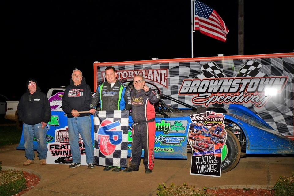 Bedford's Britan Godsey (middle right) poses with his papaw Ray Godsey Sr. (middle left), his dad Edgar (right) and uncle Tony (left) after claiming his first career win at Brownstown Speedway.