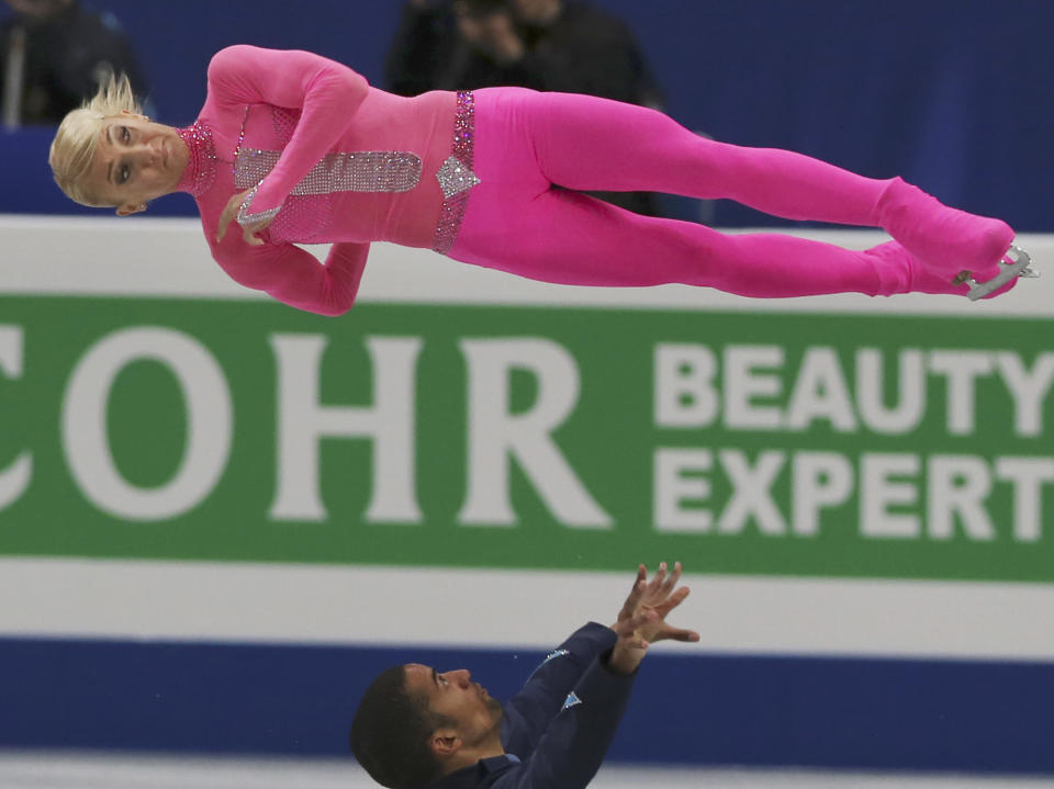 Aliona Savchenko and Robin Szolkowy of Germany perform during a pairs short program of the World Figure Skating Championships in Saitama, near Tokyo,Wednesday, March 26, 2014. (AP Photo/Koji Sasahara)