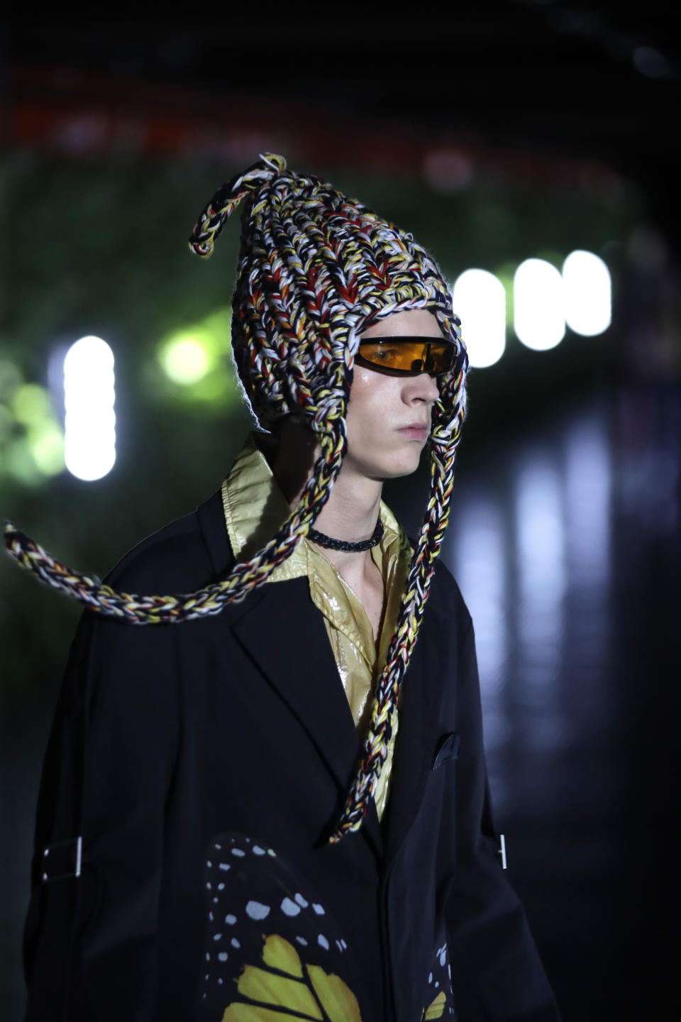 A model wears a creation as part of the Palm Angels men's Spring-Summer 2020 collection, unveiled during the fashion week, in Milan, Italy, Sunday, June 16, 2019. (AP Photo/Luca Bruno)