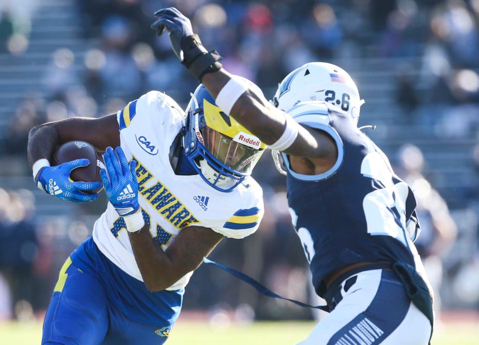 Delaware's Marcus Yarns (left) tries to get past Villanova's Tyrell Mims in the second quarter of Delaware's 29-26 loss at Villanova Stadium, Saturday, Nov. 19, 2022.