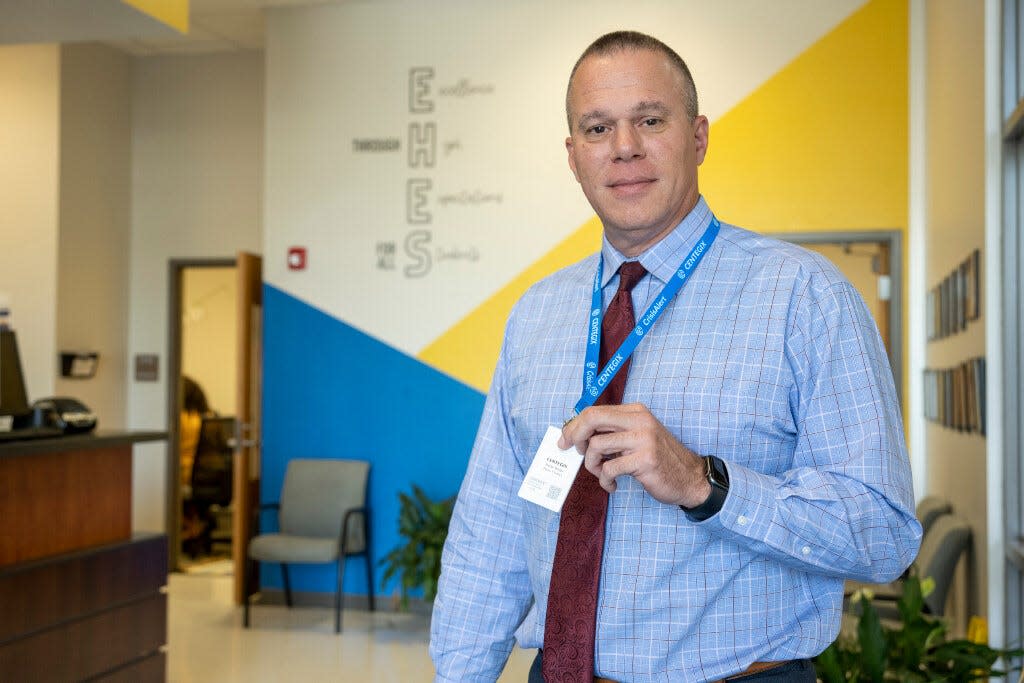 Joseph Mabry, Supervisor of Safety for Lake County Schools, shows off the new Centegix alert badge at the Eustis Heights Elementary School.