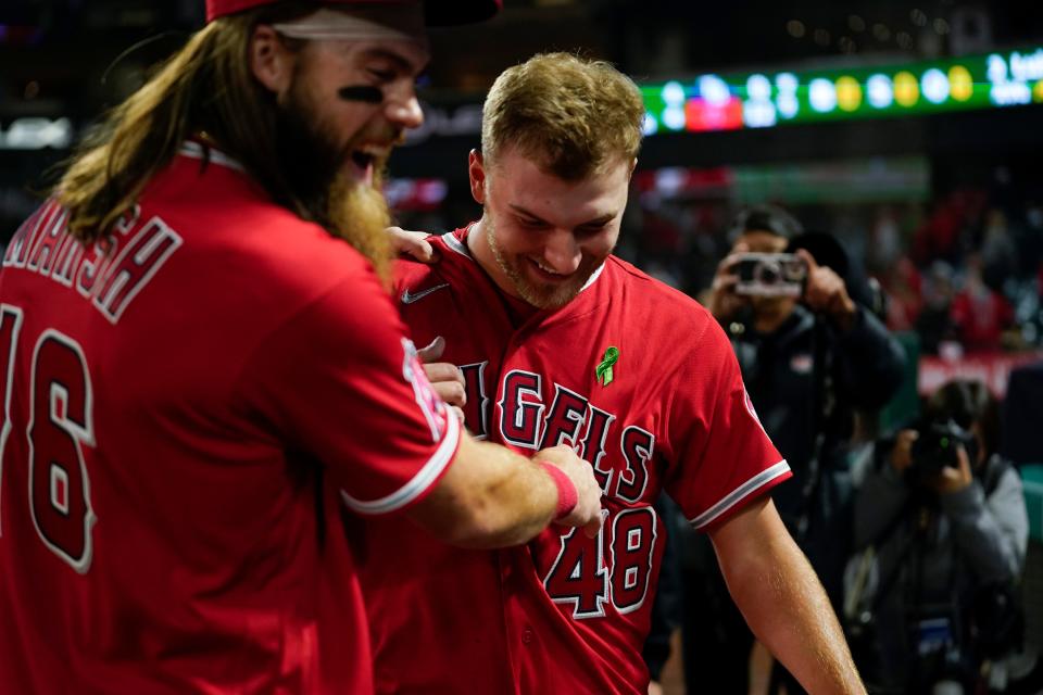 Los Angeles Angels starting pitcher Reid Detmers (48) celebrates with Brandon Marsh (16) after throwing a no-hitter against the Tampa Bay Rays in Anaheim, Calif., Tuesday, May 10, 2022. The Angels won 12-0.