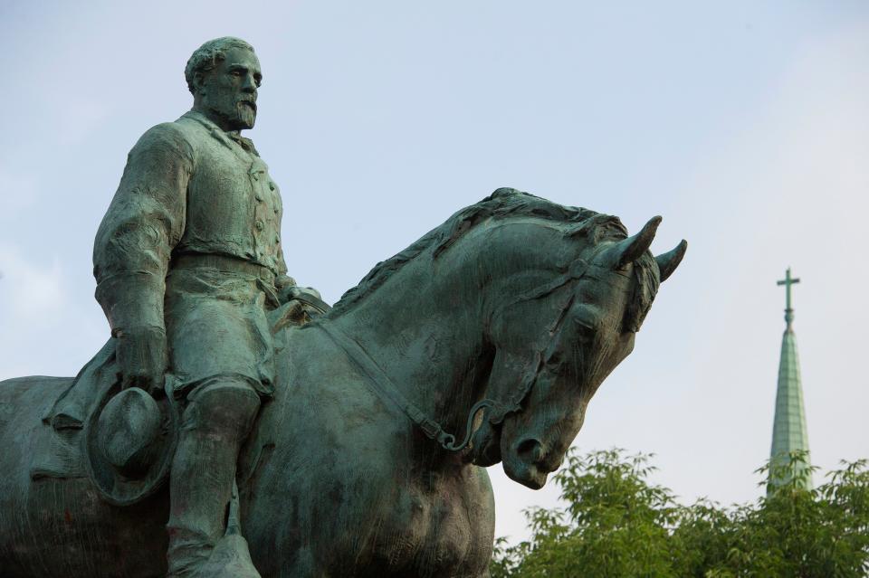 A statue of Confederate Army of Northern Virginia Gen. Robert E. Lee stands in a central park in Charlottesville, Va.