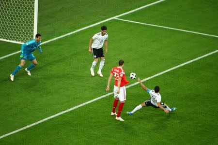 Soccer Football - World Cup - Group A - Russia vs Egypt - Saint Petersburg Stadium, Saint Petersburg, Russia - June 19, 2018 Egypt's Ahmed Fathy scores an own goal and the first for Russia REUTERS/Michael Dalder