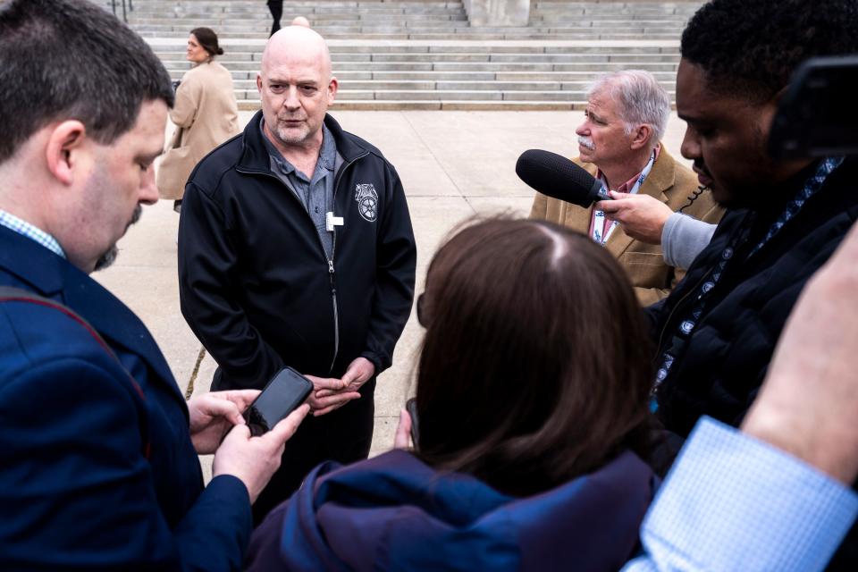 Jesse Case, secretary-treasurer of Teamsters Local 238, speaks with reporters during a demonstration at the Iowa Capitol on Wednesday.