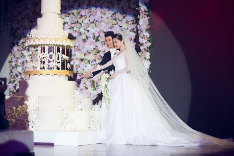 At the reception, 2,000 of their closest friends — celebrities included — ate a cake that had a working carousel as a tier.