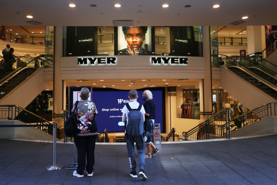 Shoppers queue outside Myer in the Pitt Street shopping district in Sydney, Australia. 