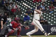 Milwaukee Brewers' Travis Shaw hits an RBI double during the eighth inning of a baseball game against the St. Louis Cardinals Wednesday, May 12, 2021, in Milwaukee. (AP Photo/Morry Gash)