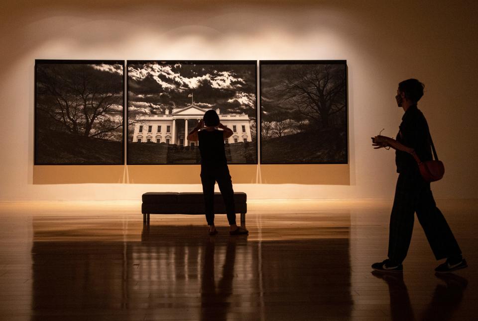A charcoal work by American artist Robert Longo shows the White House on display as a part of the "Storm of Hope: Law & Disorder," exhibit at the Palm Springs Art Museum, Thursday, Sept. 2, 2021, in Palm Springs. 