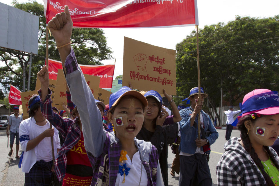 FILE - In this May 1, 2018, file photo, Myanmar workers, mostly from garment and shoe factories, take part in a May Day march in Yangon, Myanmar. Garment workers in Myanmar are urging major international brands to denounce the recent military coup there and put more pressure on factories to protect workers from being fired or harassed — or worse arrested and killed for participating in protests. (AP Photo, File)