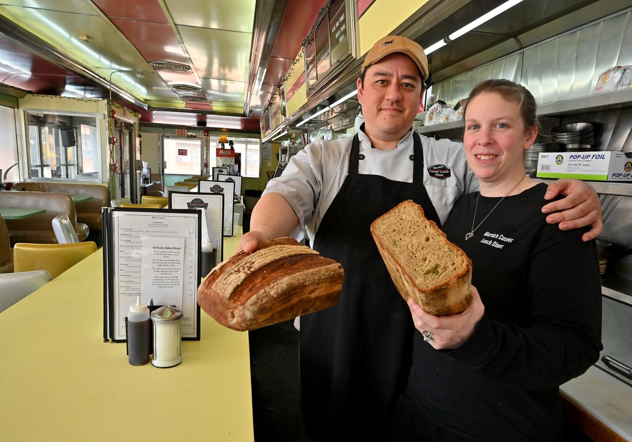 Marvin's Corner Lunch owners Josh and Jennie Plahm with the pickle bread they make and sell.