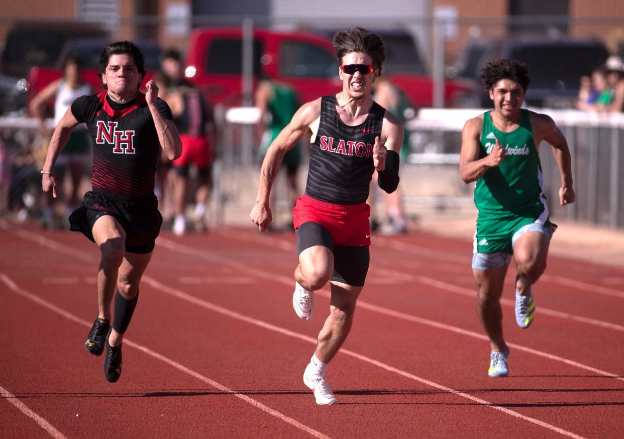 Slaton's Isaias Gallegos, center, competes in the 100-meter dash during the A-Town Relays, Friday, March 22, 2024, at Antelope Stadium in Abernathy.