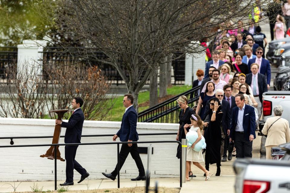 Mourners arrive for the celebration of Evelyn’s life (AP)