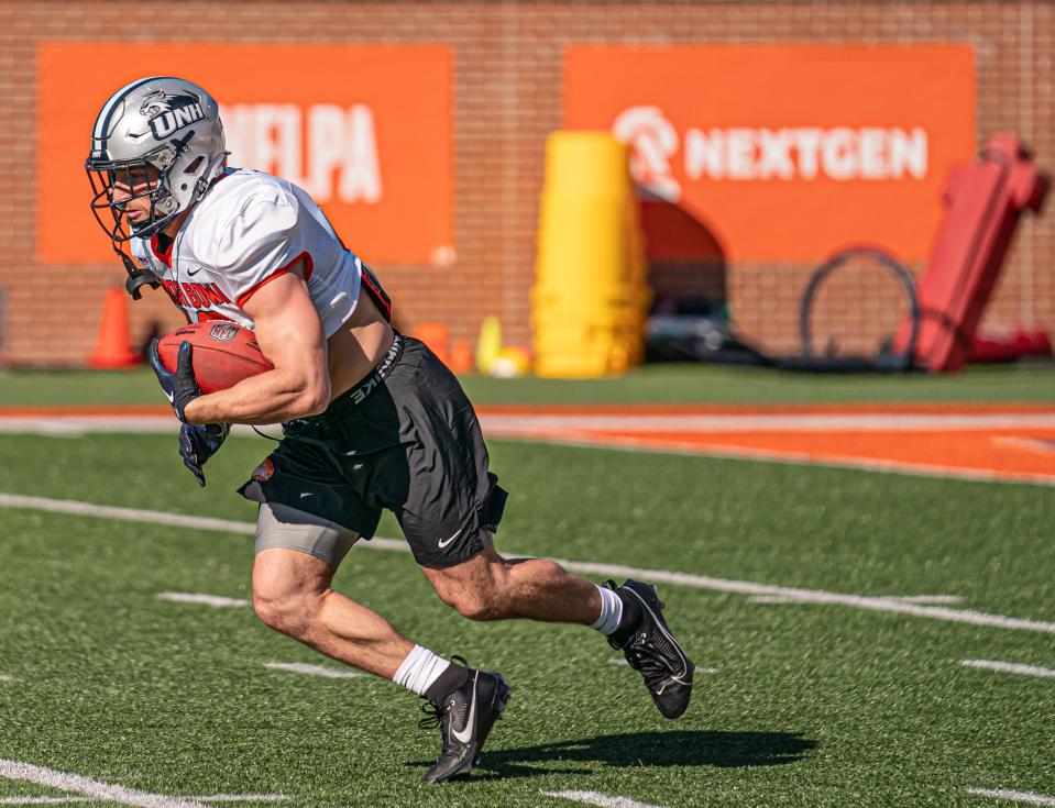 University of New Hampshire football senior Dylan Laube goes through drills at the Reese's Senior Bowl last week in Mobile, Alabama. Multiple reports surfaced that said Laube's NFL stock rose more than anyone from the week-long camp and game in Alabama.