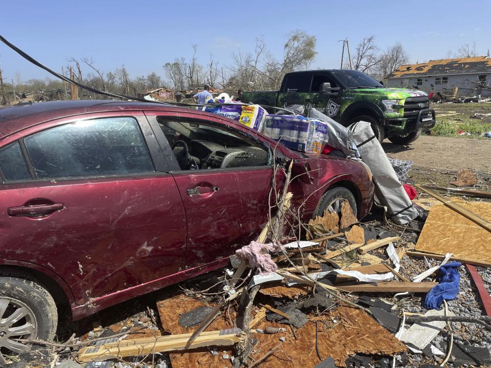 Debris covers the ground on Saturday, March 25, 2023 in Silver City, Miss. Emergency officials in Mississippi say several people have been killed by tornadoes that tore through the state on Friday night, destroying buildings and knocking out power as severe weather produced hail the size of golf balls moved through several southern states. (AP Photo/Michael Goldberg)