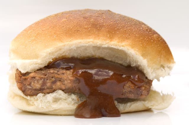 A ROLL WITH LORNE SAUSAGE AND BROWN SAUCE