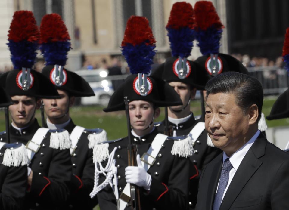 Chinese President Xi Jinping pays his tribute to the Monument of the Unknown Soldier, in Rome, Friday, March 22, 2019. Jinping is launching a two-day official visit aimed at deepening economic and cultural ties with Italy through an ambitious infrastructure building program called &quot;Belt and Road&quot; that has raised suspicions among Italy's U.S. and European allies. (AP Photo/Alessandra Tarantino)