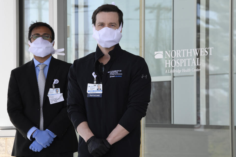 In this Thursday, April 2, 2020, photo Dr. Daniel Durand, Chief Innovation Officer at Lifebridge Health, right, and Pothik Chatterjee, Executive Director of Innovation and Research at Lifebridge Health, left, pose for a portrait in Randallstown, Md. (AP Photo/Susan Walsh)