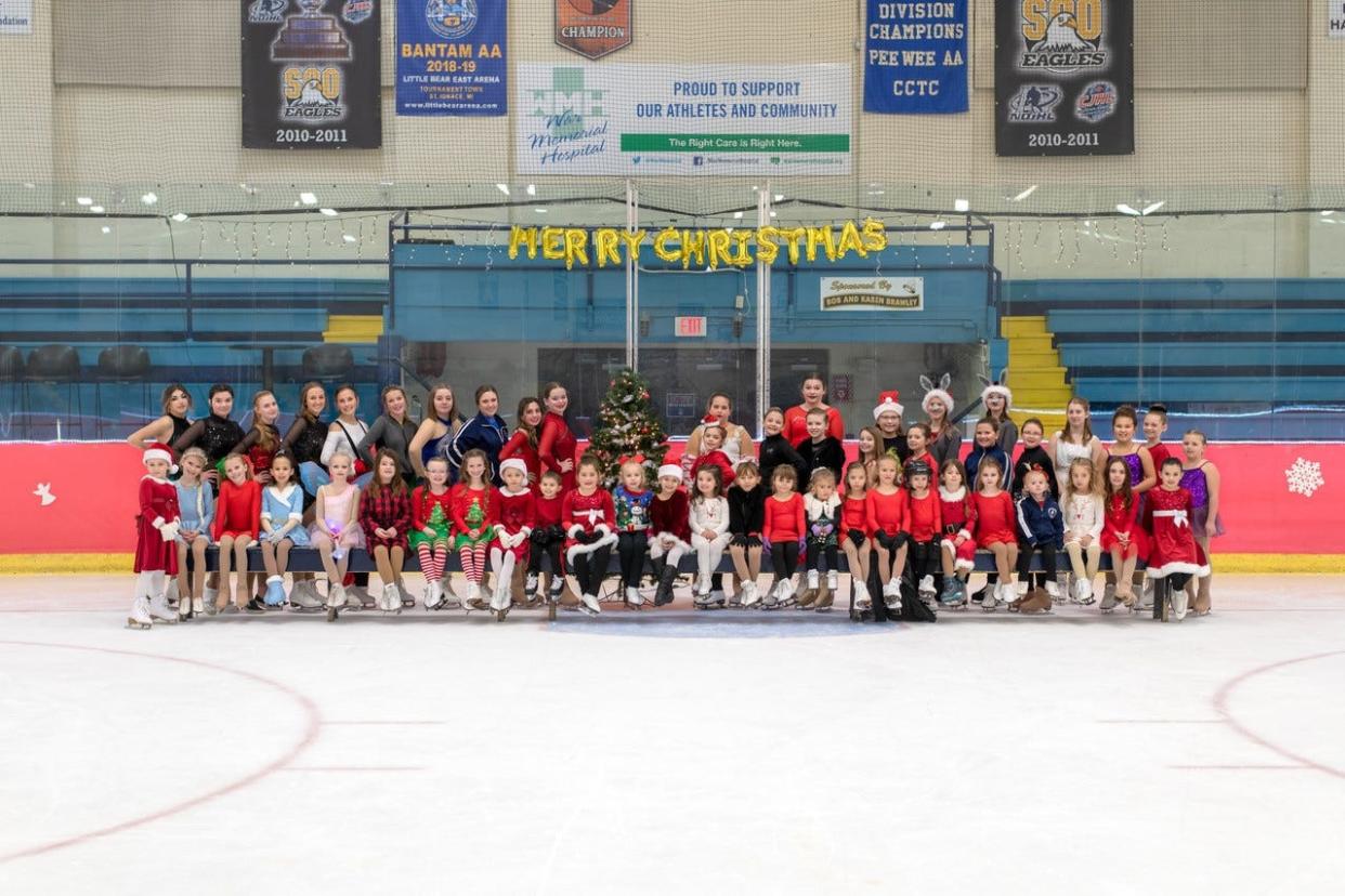 Performers of the Hiawatha Skating Club Christmas gala after their performance in 2021.