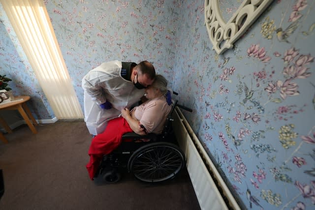Man embraces mother at care home on Christmas Day