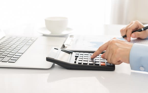 Man using a calculator