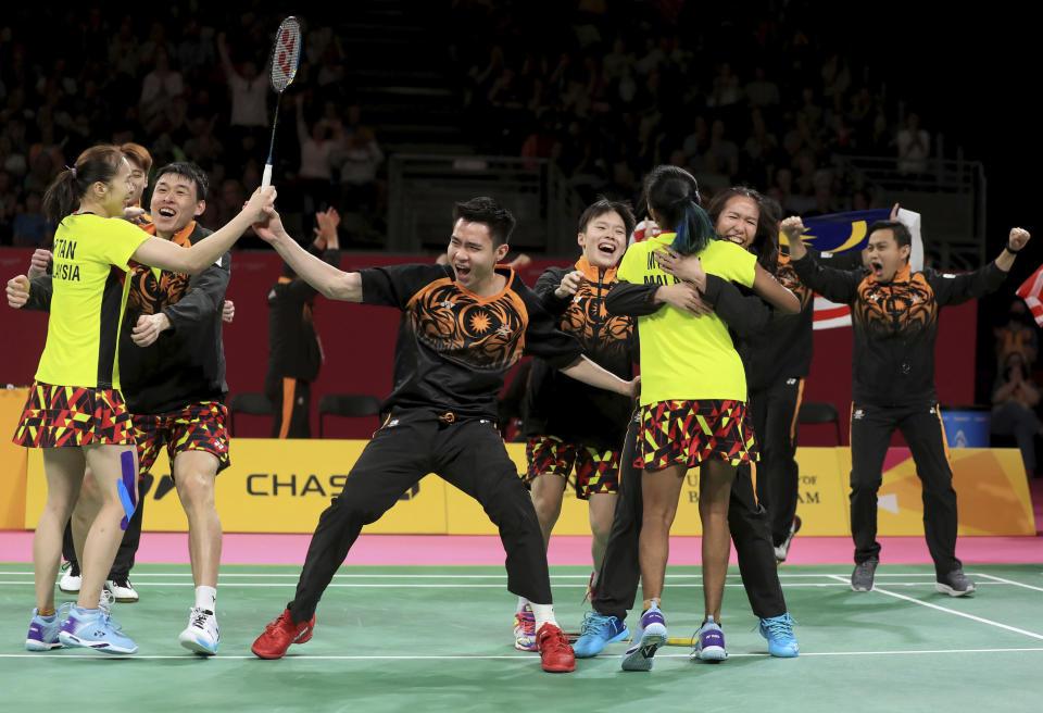 Team Malaysia celebrate winning a gold medal in Badminton Team event at The NEC on day five of 2022 Commonwealth Games in Birmingham, England, Tuesday August 2, 2022. (Bradley Collyer/PA via AP)