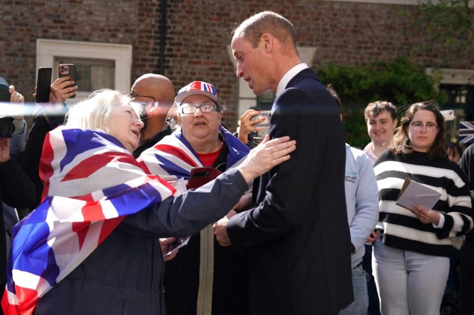 Royal fans draped in Union Jack flags asked William about his family. via REUTERS